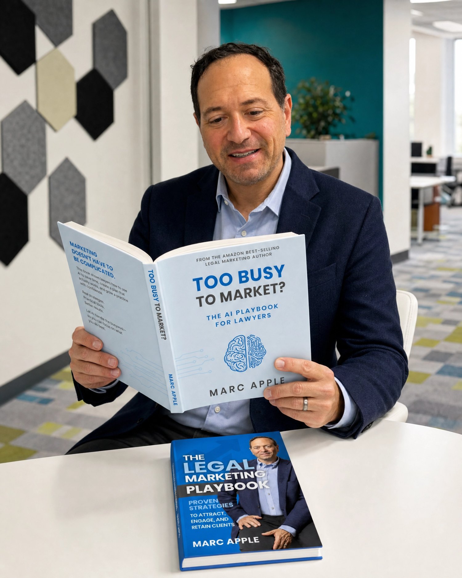 Marc Apple holding his two #1 Amazon bestselling books